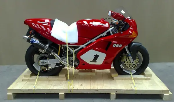 Shared motorcycle shipping — motorbikes crated for export